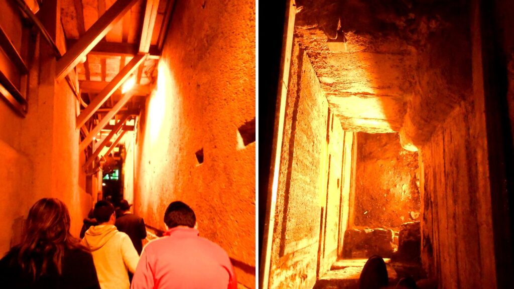 嘆きの壁のトンネルツアー。石造りの狭い通路をオレンジ色の照明が照らし、参加者が歩いている