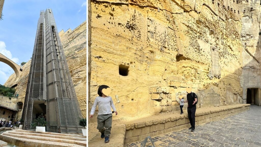 港から城壁の上の町へ上がるバラッカ・リフトと、城壁の下を歩く家族。